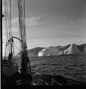 Image of Large icebergs seen beyond deck