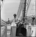 Image of Clayton coming up onto deck with oxo cup