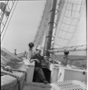 Image of Clayton coming up onto deck with oxo cup