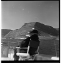 Image of MacMillan sitting on deck