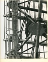 Image of Man climbing  in antenna superstructure