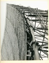 Image of Man standing within antenna superstructure