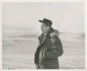 Image of Harold Grundy standing on snowy plain, hands in jacket pockets