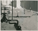 Image of Pipes and valves in snow, Thule AFB