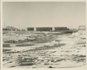 Image of Snowy foreground with buildings {barracks?} at Thule AFB
