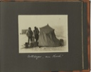 Image of Zeltlager "am Bach" [Tent camp at "The Creek": two men standing by small tent, with supplies]