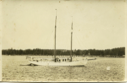 Image of Schooner in Harbor with Crew Aboard