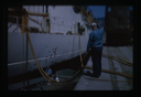 Image of Naval ship at dock recieving maintenance