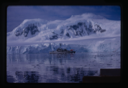 Image of Naval ship sailing near glacier