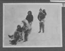 Image of Eskimos - baby and three children, tiny sledge