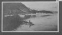 Image of A group in whaleboat off an icy shoreline