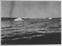 Image of [Small icebergs off shore]