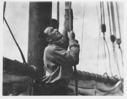 Image of [Man hoisting ? sails]