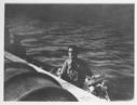 Image of [Man in small boat along side Bowdoin]