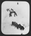 Image of [Pulling sledge up snow wall]