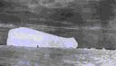Image of Iceberg in the Polar Pack; man in foreground -Smith Sound