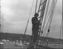 Image of Miriam MacMillan in rigging aboard the Schooner Bowdoin