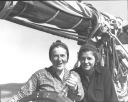 Image of Miriam MacMillan and Katie Hettasch at wheel of Bowdoin