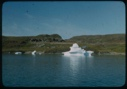 Image of Icebergs. Frame house by shore