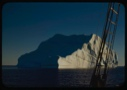 Image of Iceberg through rigging, in midnight sun