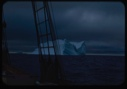 Image of Iceberg through rigging, storm clouds