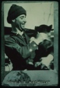 Image of Donald MacMillan and dog on S.S. Roosevelt