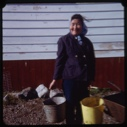 Image of Eskimo [Inuk] woman with pails