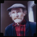 Image of Older Eskimo [Inuk] man wearing cap
