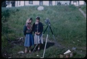 Image of Two teenage girls by Platt's camera equipment at school