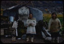 Image of Eskimo [Inuit] couple by tent