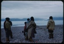 Image of Eskimos [Inuit] on the beach