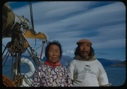 Image of Elderly Eskimo [Inuit] couple aboard (man wearing Dartmouth shirt)