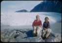 Image of Young women and boy sitting by Brother John's Glacier