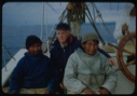 Image of Harrigan [Inukitooq], Donald MacMillan, and Ootaq by wheel
