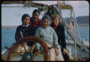 Image of Three Eskimo [Inuit] women and Miriam MacMillan, at wheel