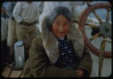 Image of Eskimo [Inuk] woman in coat with fur collar