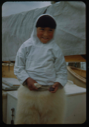 Image of Eskimo [Inuk] boy in bearskin pants, aboard
