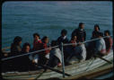 Image of Eskimos [Inuit] in open boat along side
