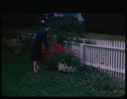Image of Miriam MacMillan inspecting the garden