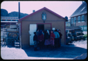 Image of Group of Inuit outside frame shed