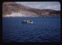 Image of Miriam and Donald MacMillan with Eskimos [Inuit] in open boat