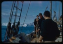 Image of Ian White and others on deck--swabbing