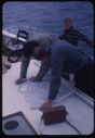 Image of Dr. William Powers and ? studying chart