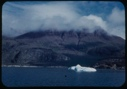 Image of Iceberg remains, clouds on mountain top