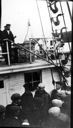 Image of Reporters aboard SS Roosevelt, clustered around Robert Peary