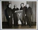 Image of [Donald MacMillan receiving Propeller Club flag]