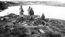 Image of 4 Inuit in sealskin clothing
