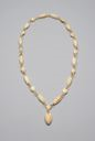 Image of Ivory necklace w/circular loops connecting oblong beads (24 in all), carved from single piece of ivory